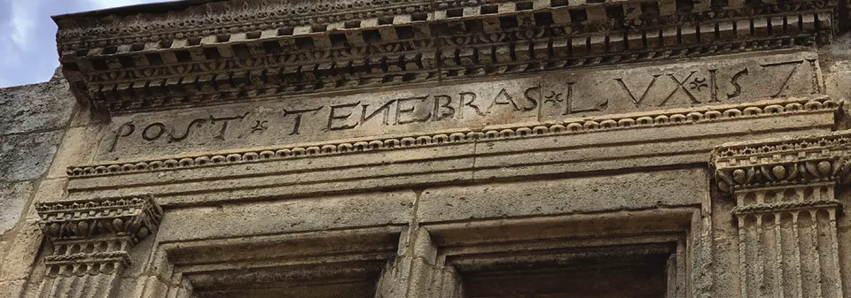 “Post Tenebras Lux” carved in the stone of a Huguenot house in Les Baux-de-Provence
