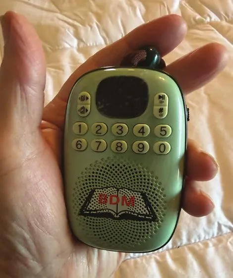 A hand-sized solar audio player loaded with Huguenot Heritage courses